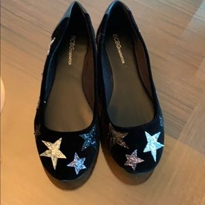 Black velvet flats with silver stars.